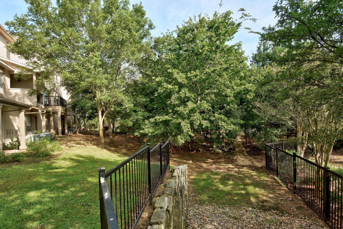 11203 Ranch Road 2222, Unit 1105 Austin, TX 78730 - Photo 28 of 35 a view of a pathway both side of yard