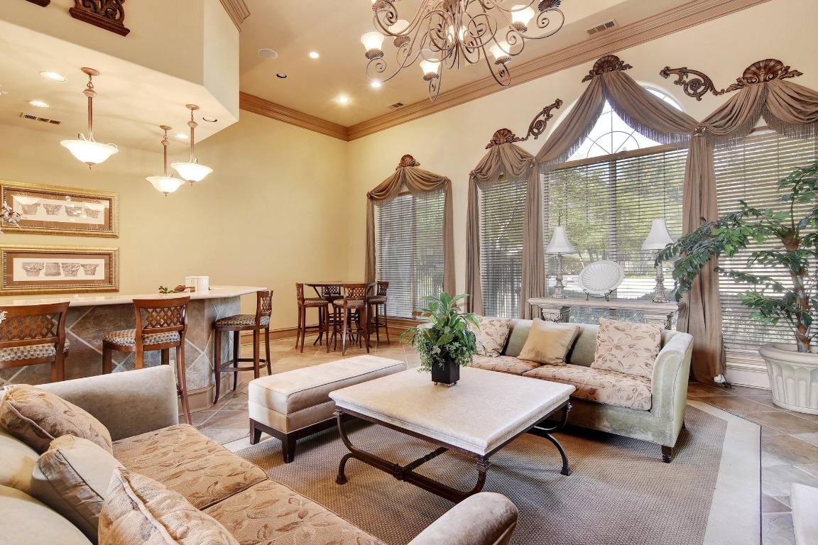 11203 Ranch Road 2222, Unit 1105 Austin, TX 78730 - Photo 33 of 35 a living room with furniture and a large window
