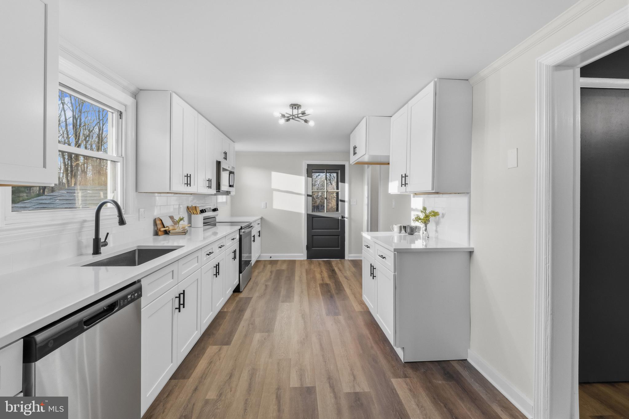 541 Robinhood Road Havre de Grace, MD 21078 - Photo 11 of 49 a kitchen with cabinets and wooden floor