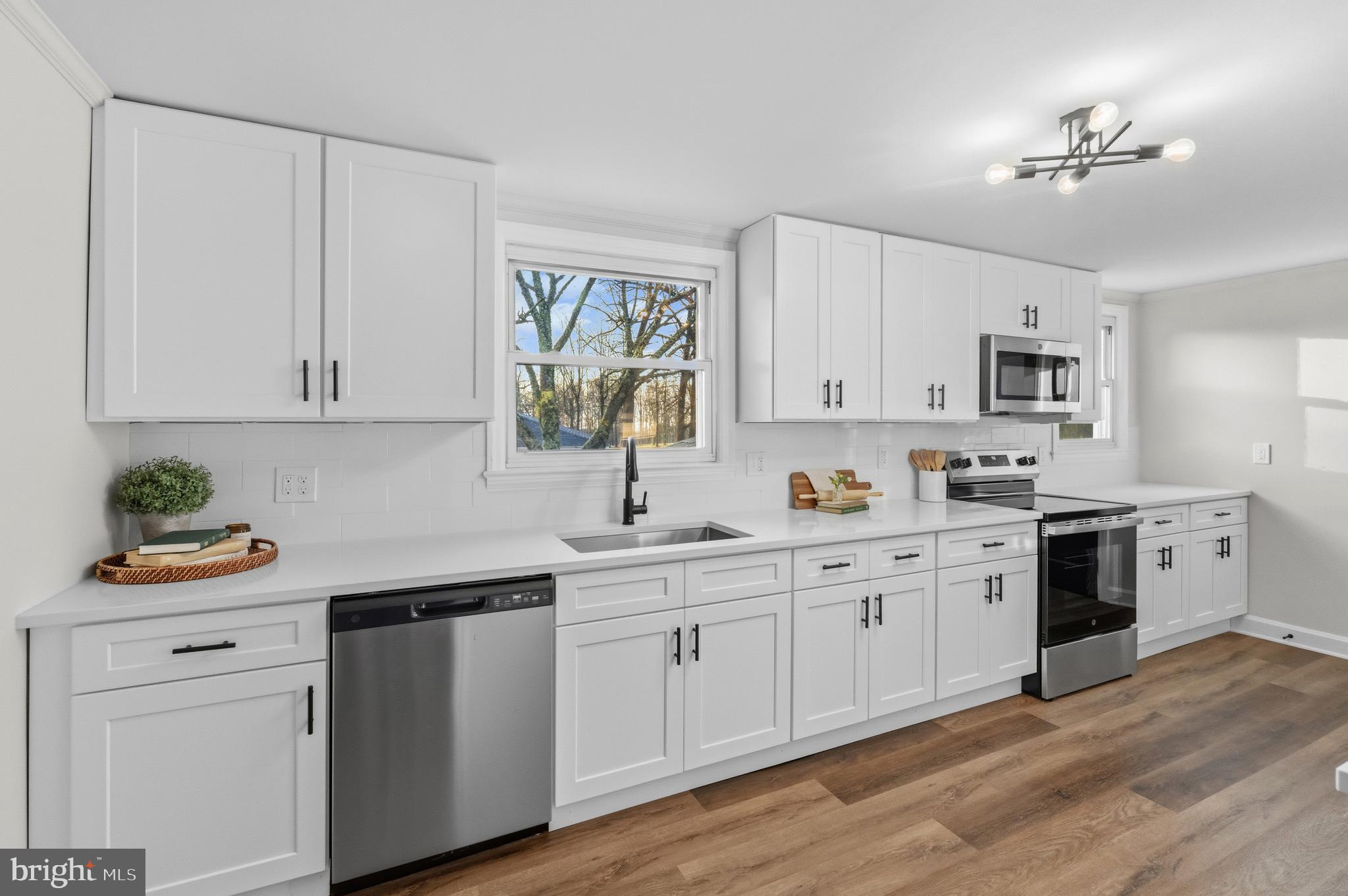 541 Robinhood Road Havre de Grace, MD 21078 - Photo 12 of 49 a kitchen with white cabinets and white appliances