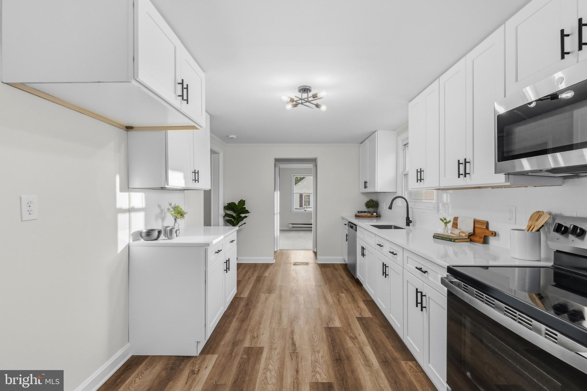 541 Robinhood Road Havre de Grace, MD 21078 - Photo 13 of 49 a large kitchen with a lot of counter space and wooden floor