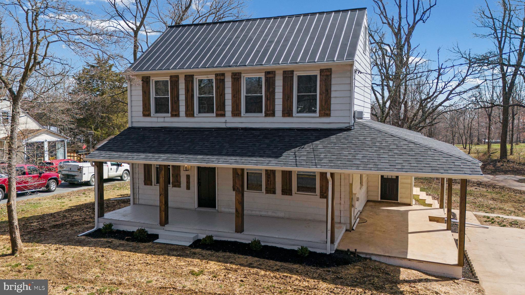 541 Robinhood Road Havre de Grace, MD 21078 - Photo 35 of 49 a view of a white house with large windows next to a road