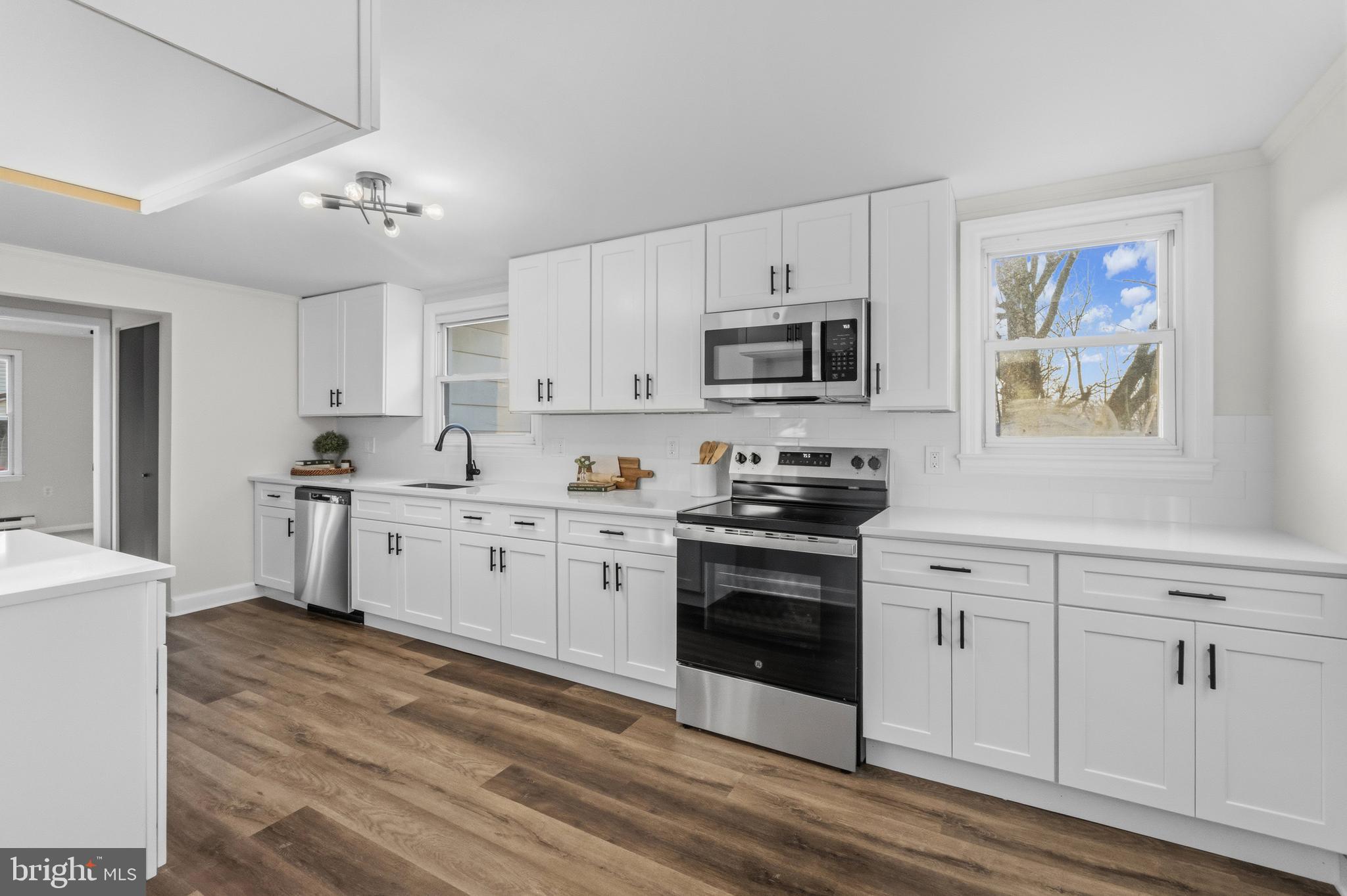 541 Robinhood Road Havre de Grace, MD 21078 - Photo 10 of 49 a kitchen with granite countertop white cabinets and stainless steel appliances
