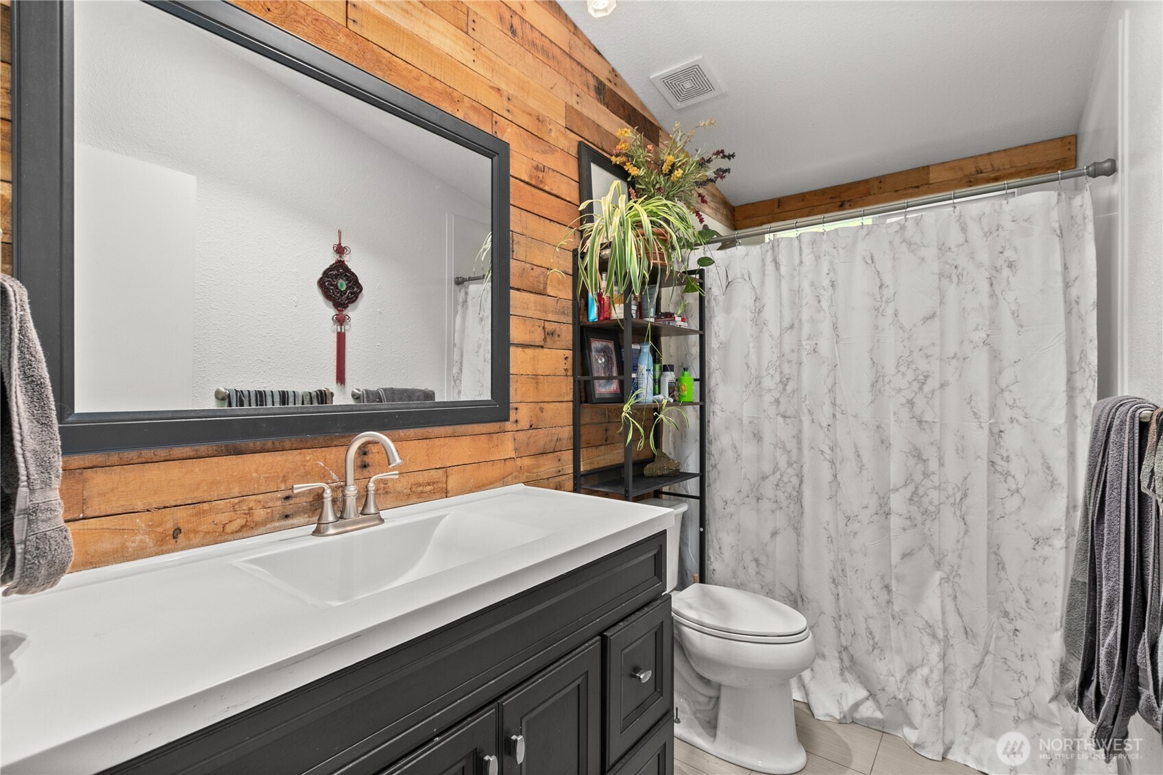 26497 Helmick Road Sedro-Woolley, WA 98284 - Photo 11 of 30 a bathroom with a sink a toilet and shower