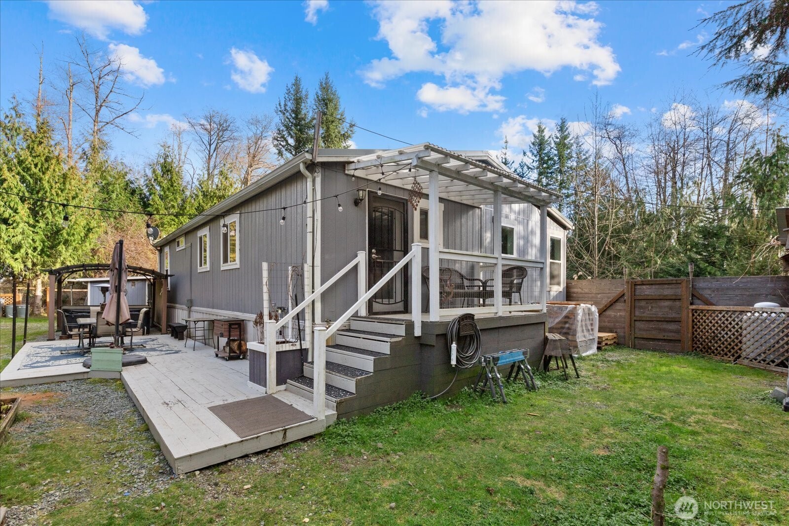 26497 Helmick Road Sedro-Woolley, WA 98284 - Photo 13 of 30 a view of a house with backyard and sitting area