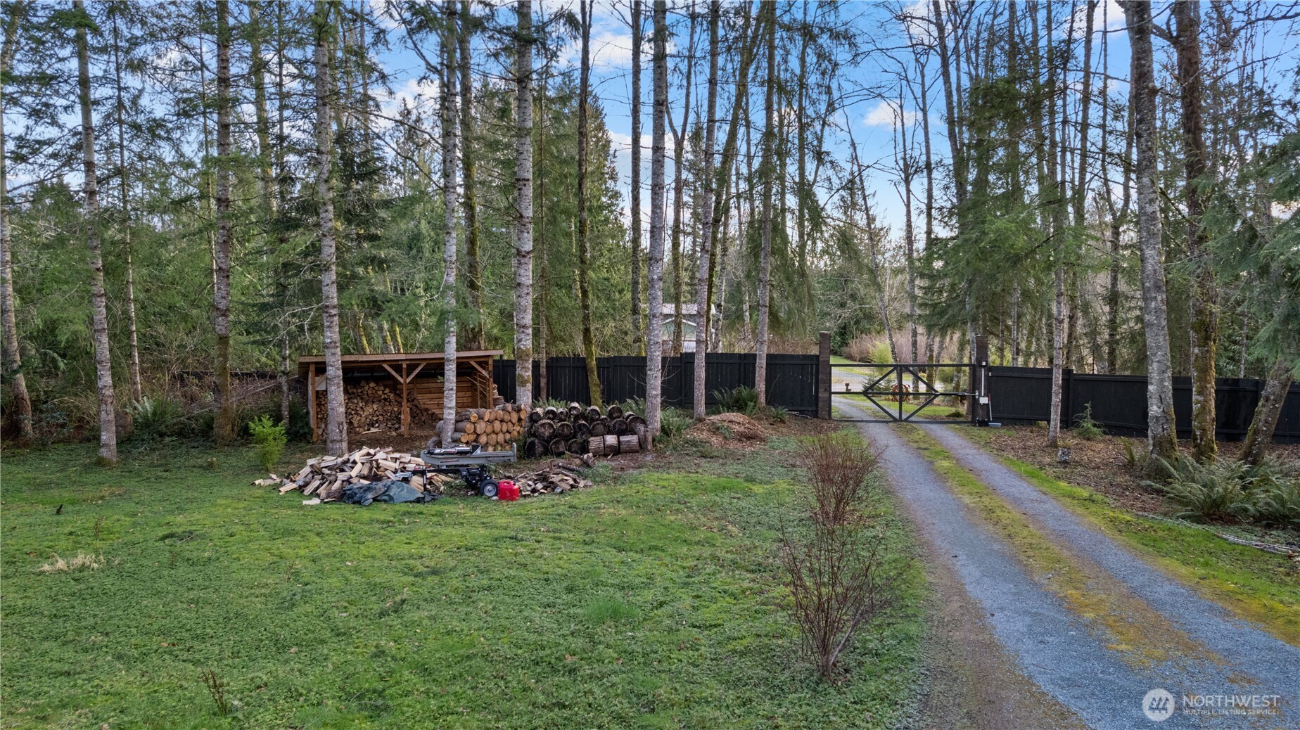 26497 Helmick Road Sedro-Woolley, WA 98284 - Photo 22 of 30 a view of a chair and table in backyard of the house