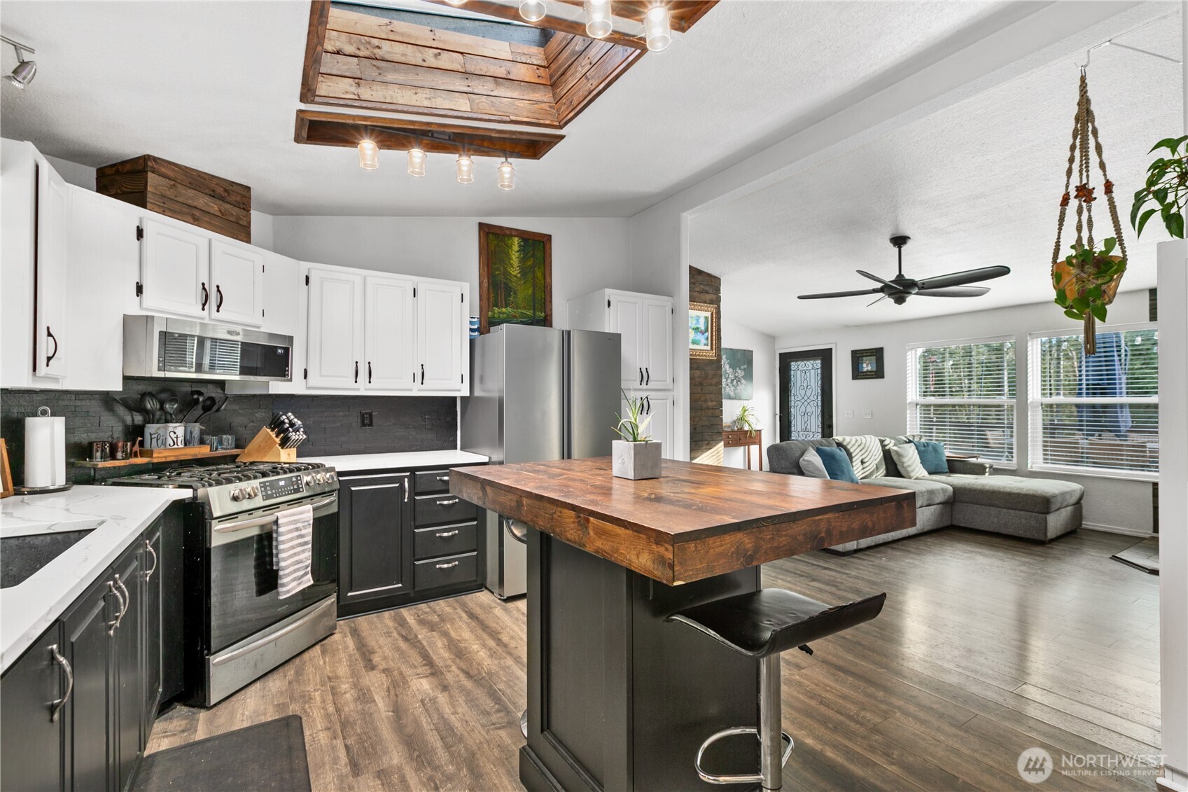 26497 Helmick Road Sedro-Woolley, WA 98284 - Photo 3 of 30 a kitchen with stainless steel appliances granite countertop a stove a sink dishwasher and a refrigerator