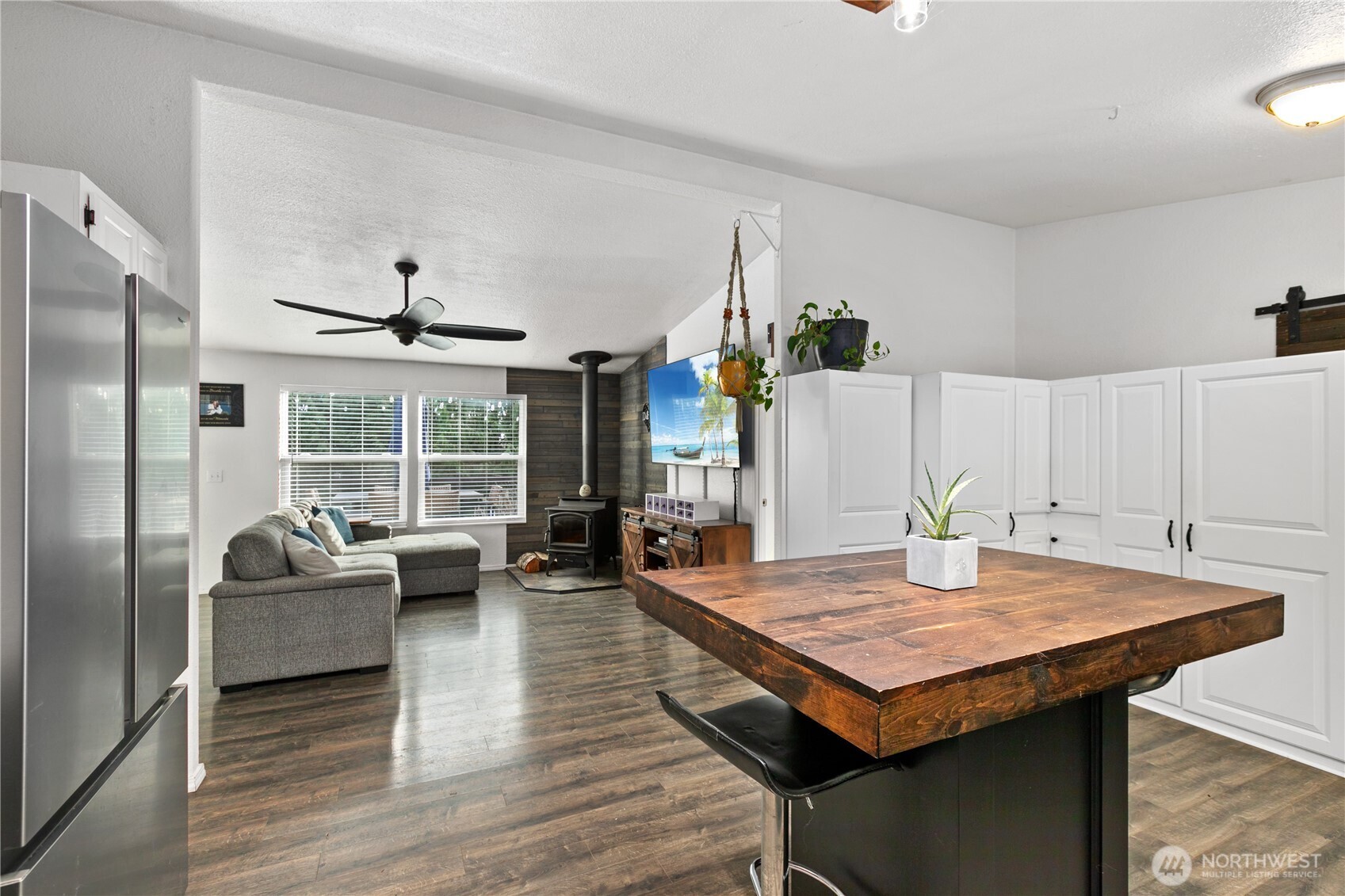 26497 Helmick Road Sedro-Woolley, WA 98284 - Photo 5 of 30 a living room with furniture a table and kitchen view