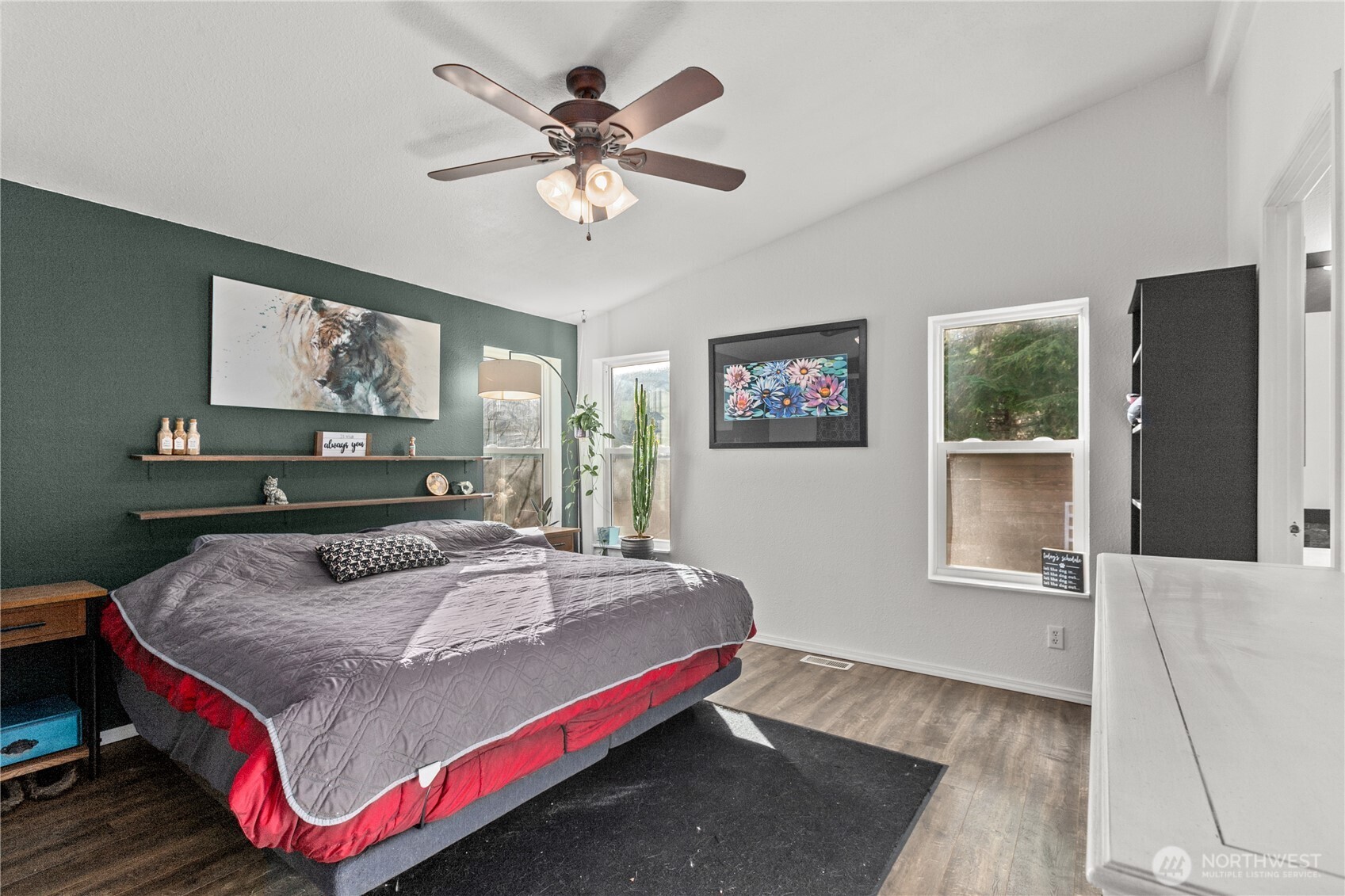 26497 Helmick Road Sedro-Woolley, WA 98284 - Photo 7 of 30 a bedroom with a bed and a painting on the wall