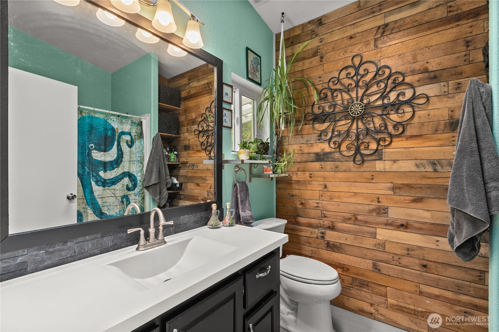 26497 Helmick Road Sedro-Woolley, WA 98284 - Photo 8 of 30 a bathroom with a sink a toilet and shower