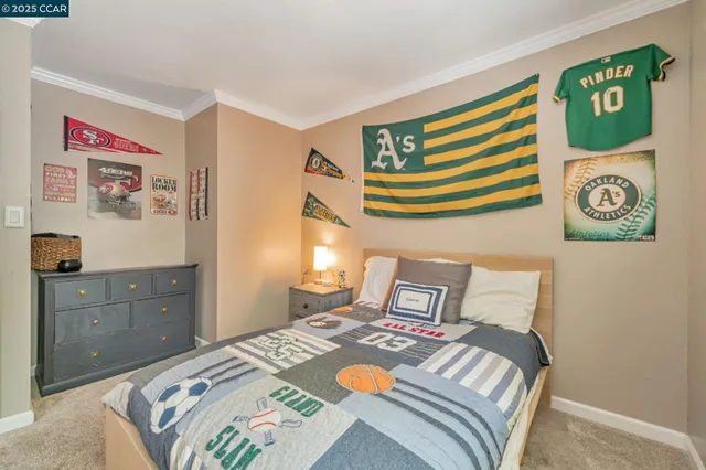 a bedroom with a bed and a dresser in it