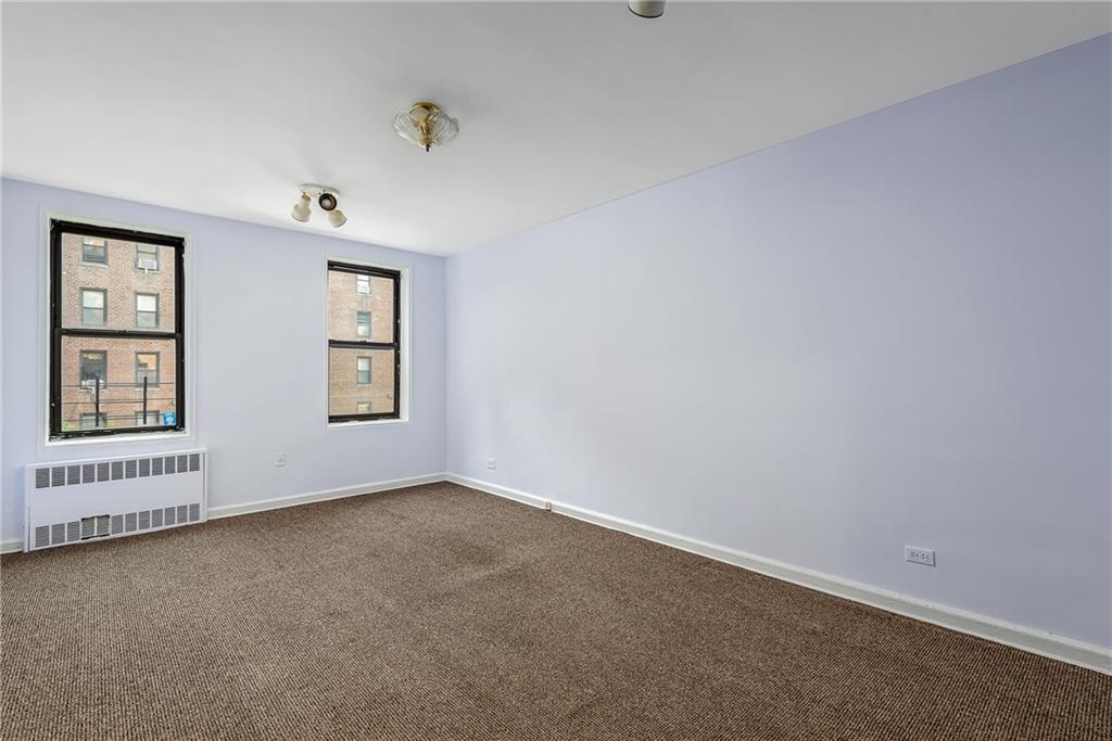 2425 Haring Street, Unit 2K Brooklyn, NY 11235 - Photo 2 of 12 an empty room with windows