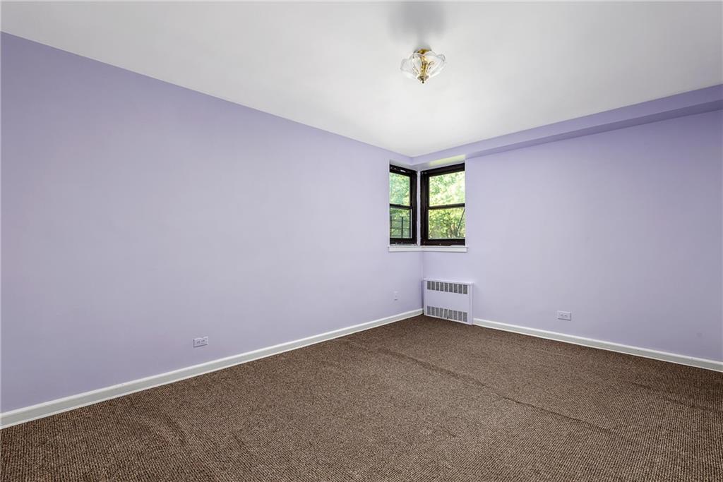 2425 Haring Street, Unit 2K Brooklyn, NY 11235 - Photo 4 of 12 an empty room with windows