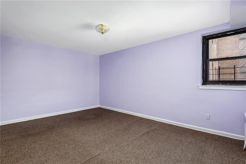 2425 Haring Street, Unit 2K Brooklyn, NY 11235 - Photo 5 of 12 an empty room with windows