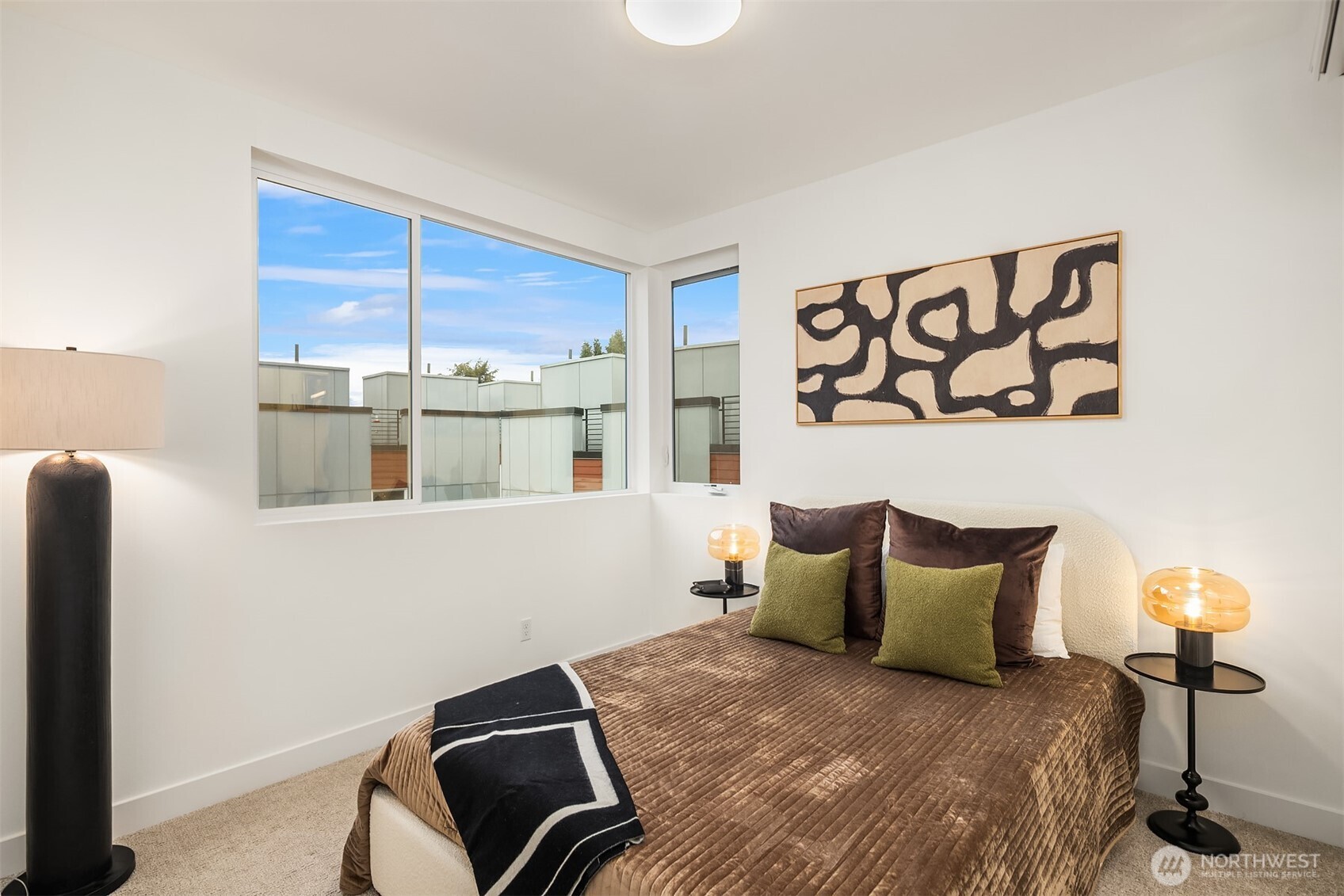 1827 14th Avenue, Unit B Seattle, WA 98122 - Photo 12 of 27 a bedroom with a bed and wooden floor