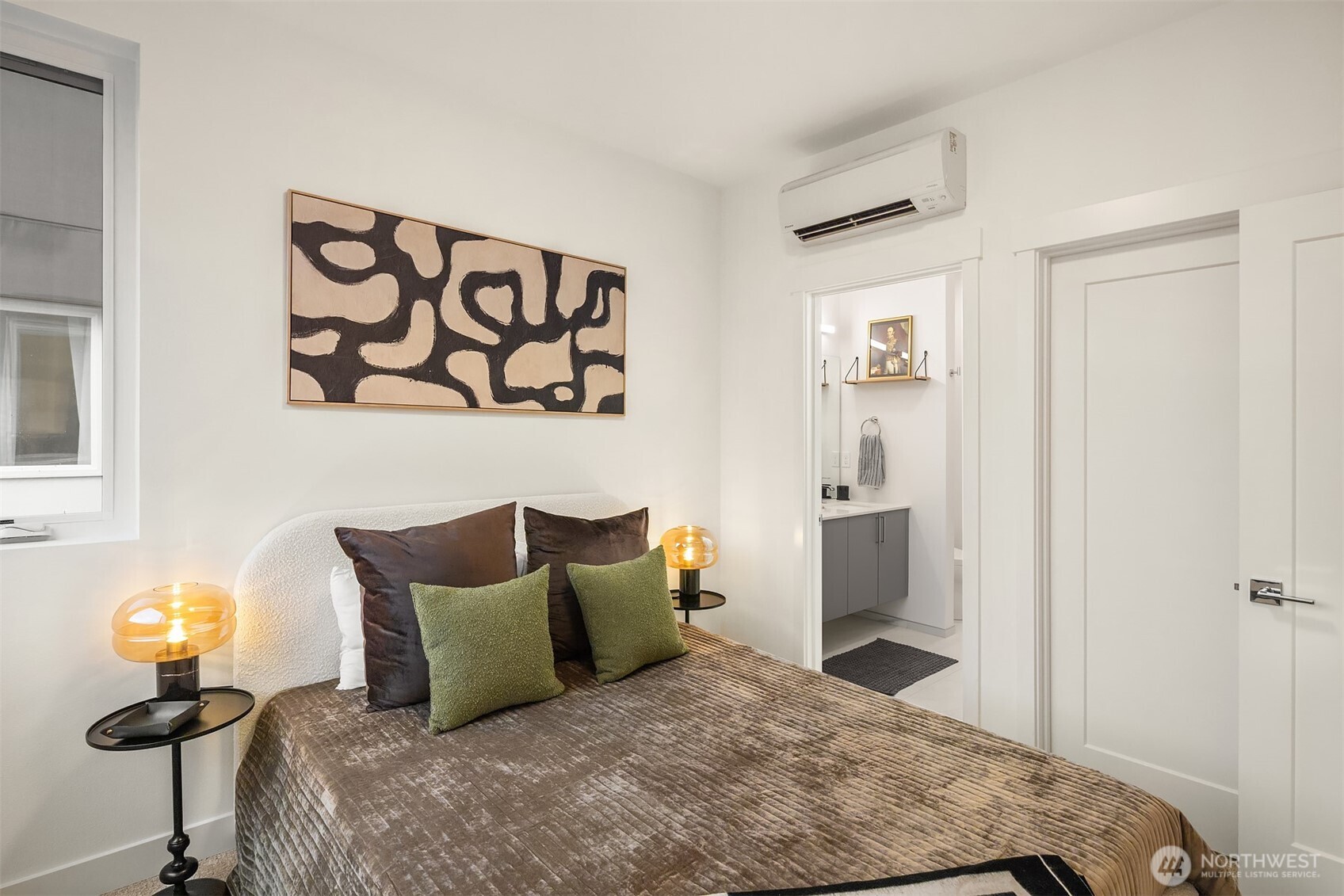 1827 14th Avenue, Unit B Seattle, WA 98122 - Photo 13 of 27 a bedroom with a bed and teddy