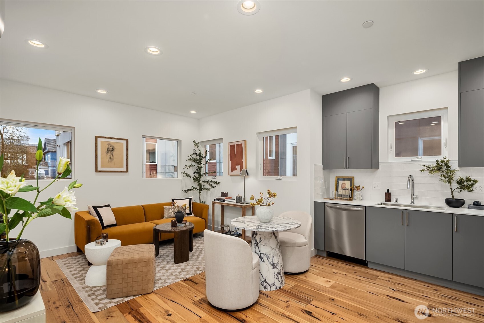 1827 14th Avenue, Unit B Seattle, WA 98122 - Photo 19 of 27 a living room with furniture a flat screen tv and a table