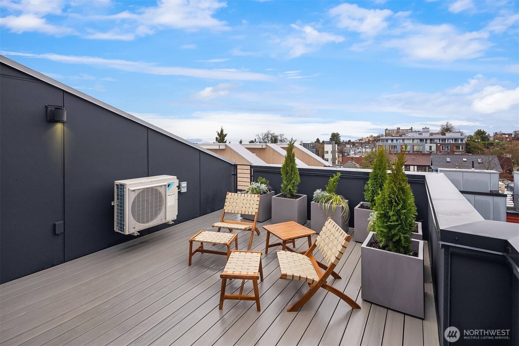 1827 14th Avenue, Unit B Seattle, WA 98122 - Photo 22 of 27 a balcony with wooden floor table and chairs
