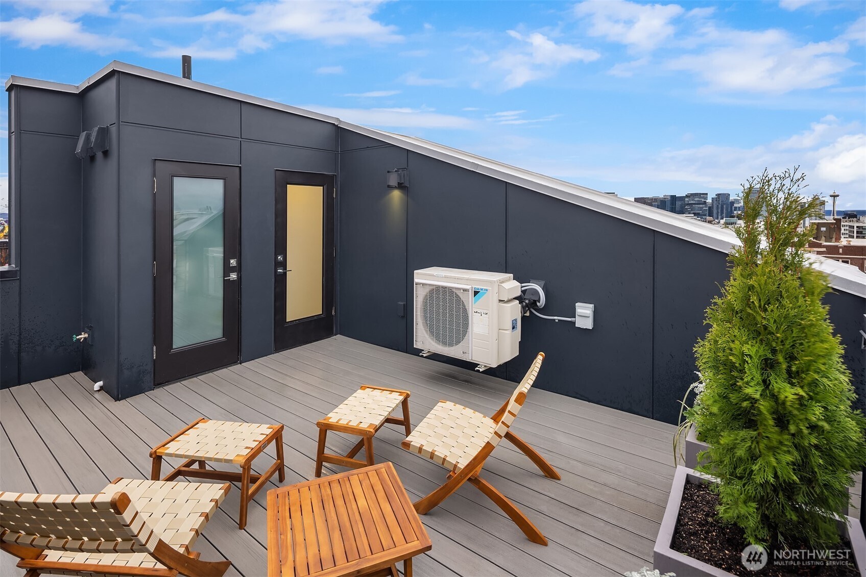 1827 14th Avenue, Unit B Seattle, WA 98122 - Photo 23 of 27 a backyard of a house with wooden floor barbeque oven and yard