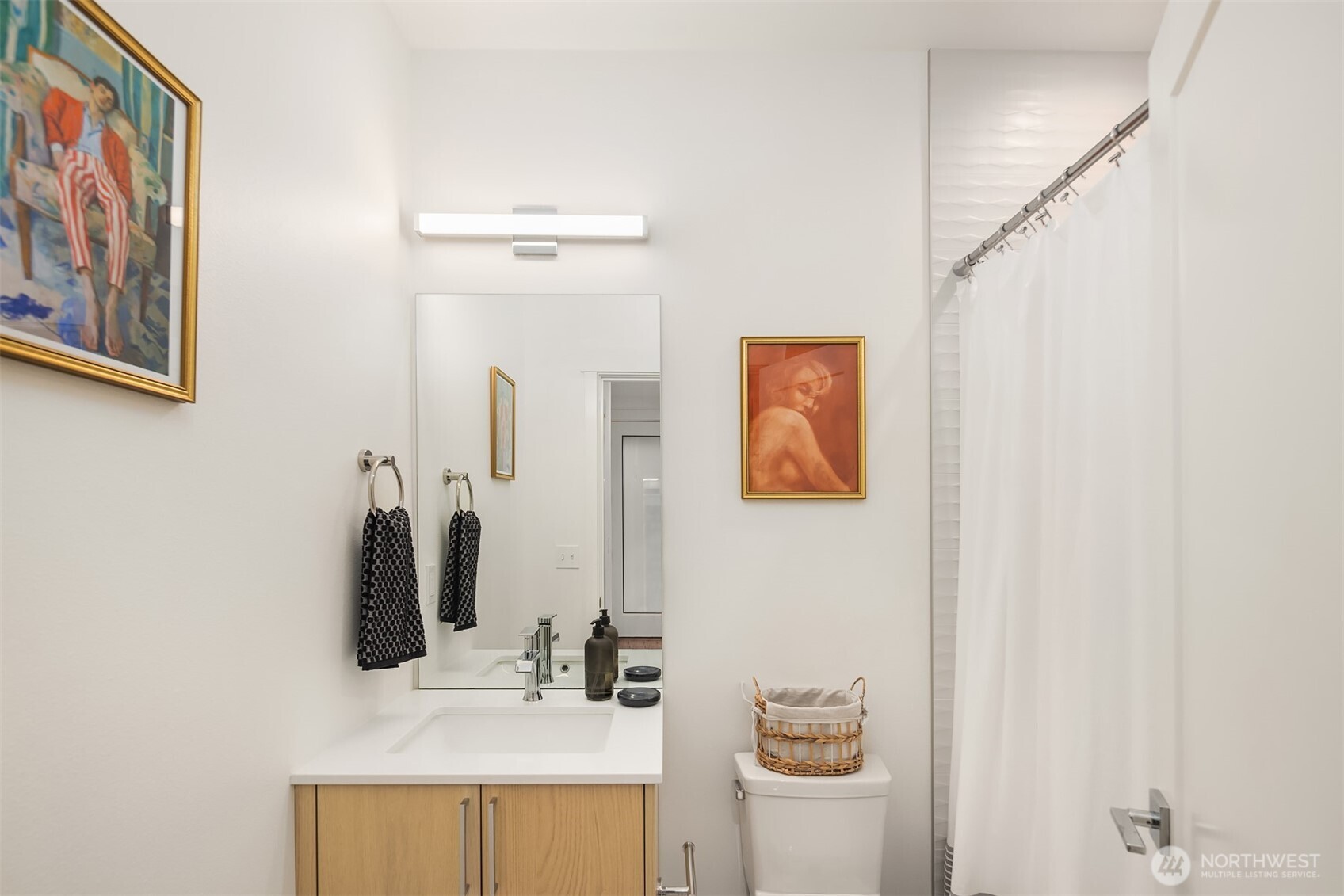1827 14th Avenue, Unit B Seattle, WA 98122 - Photo 4 of 27 a bathroom with a sink and a mirror