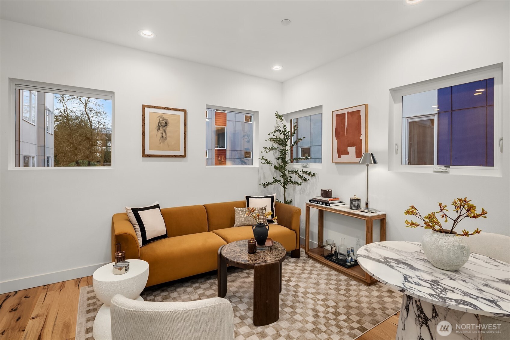 1827 14th Avenue, Unit B Seattle, WA 98122 - Photo 9 of 27 a living room with furniture and painting on the wall