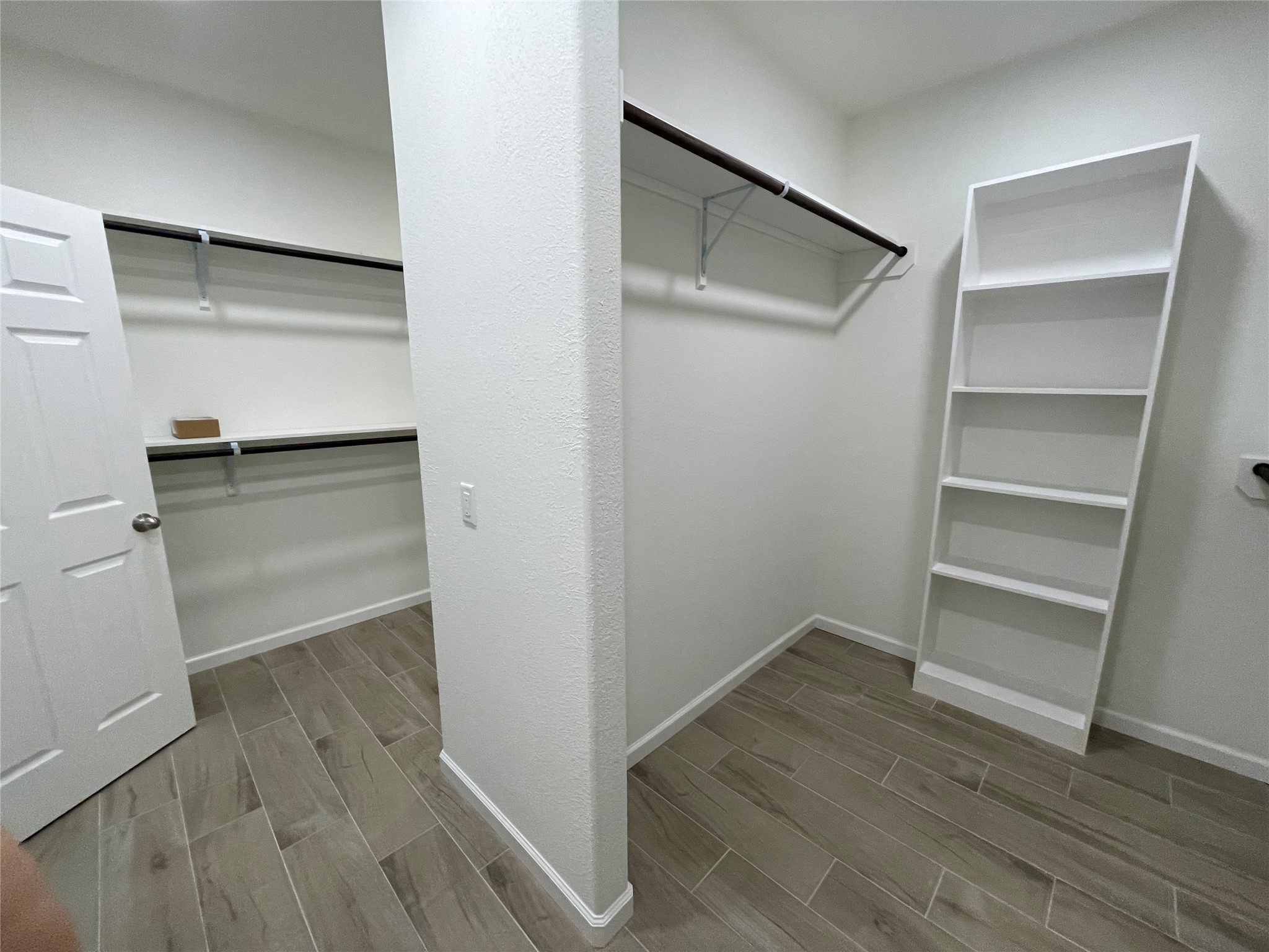 4118 Guild Meadows Drive Houston, TX 77084 - Photo 31 of 35 a view of walk in closet with empty racks