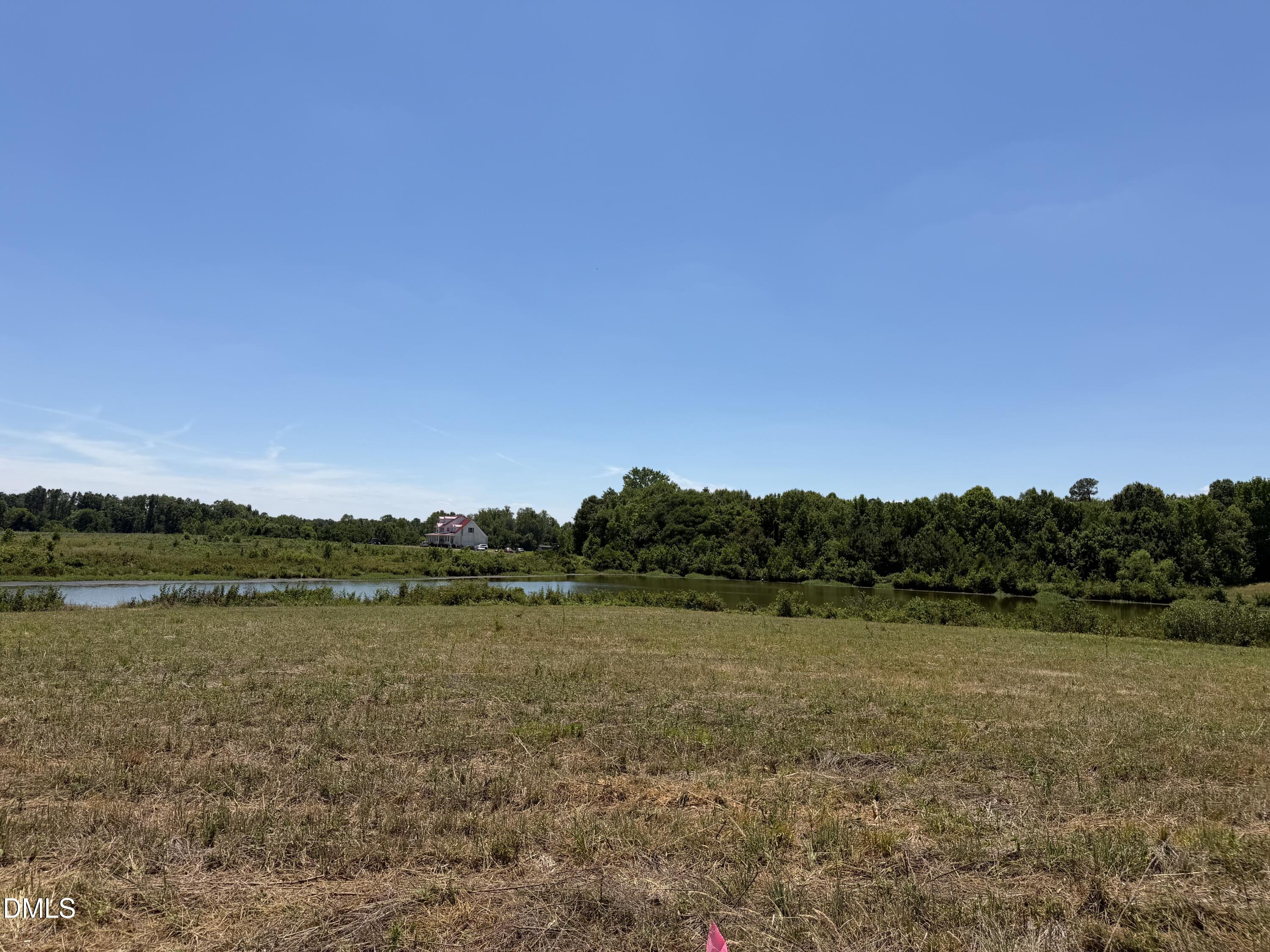 6020 Corbett Ridge Road Mebane, NC 27302 - Photo 14 of 20 a view of lake with houses in background