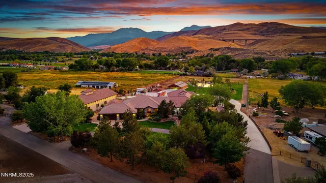 a view of a lake with couches and city view