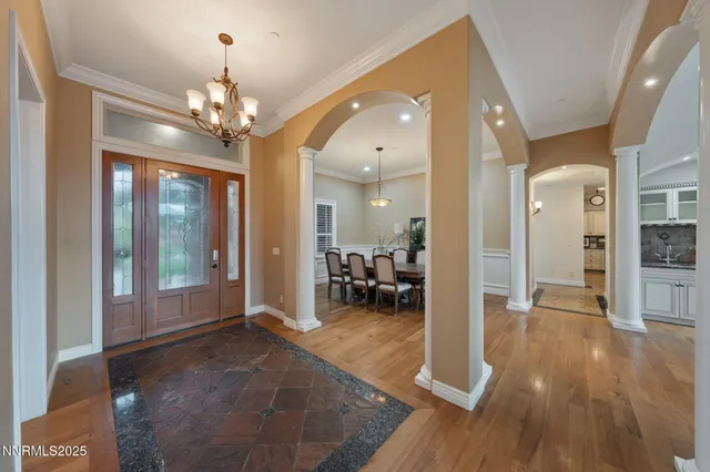 a view of a livingroom with a fireplace and window