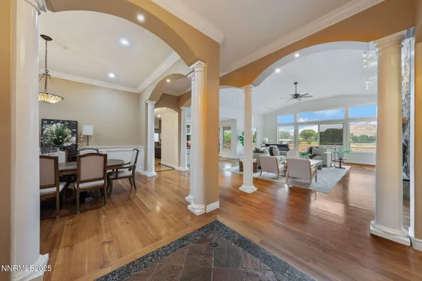 a view of a dining room with furniture window and wooden floor