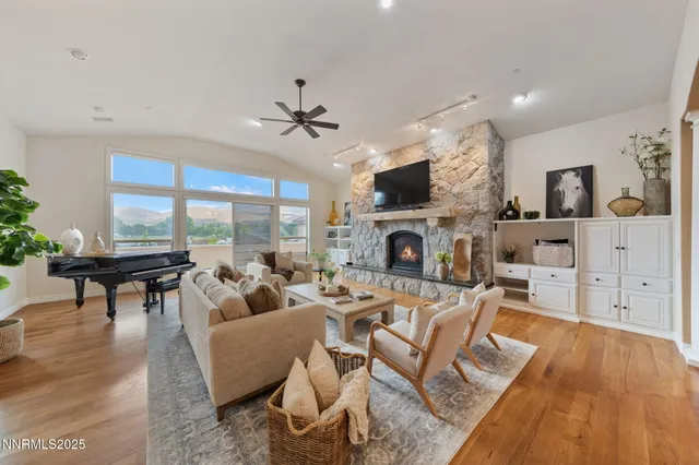 a spacious bedroom with a large bed and a fireplace