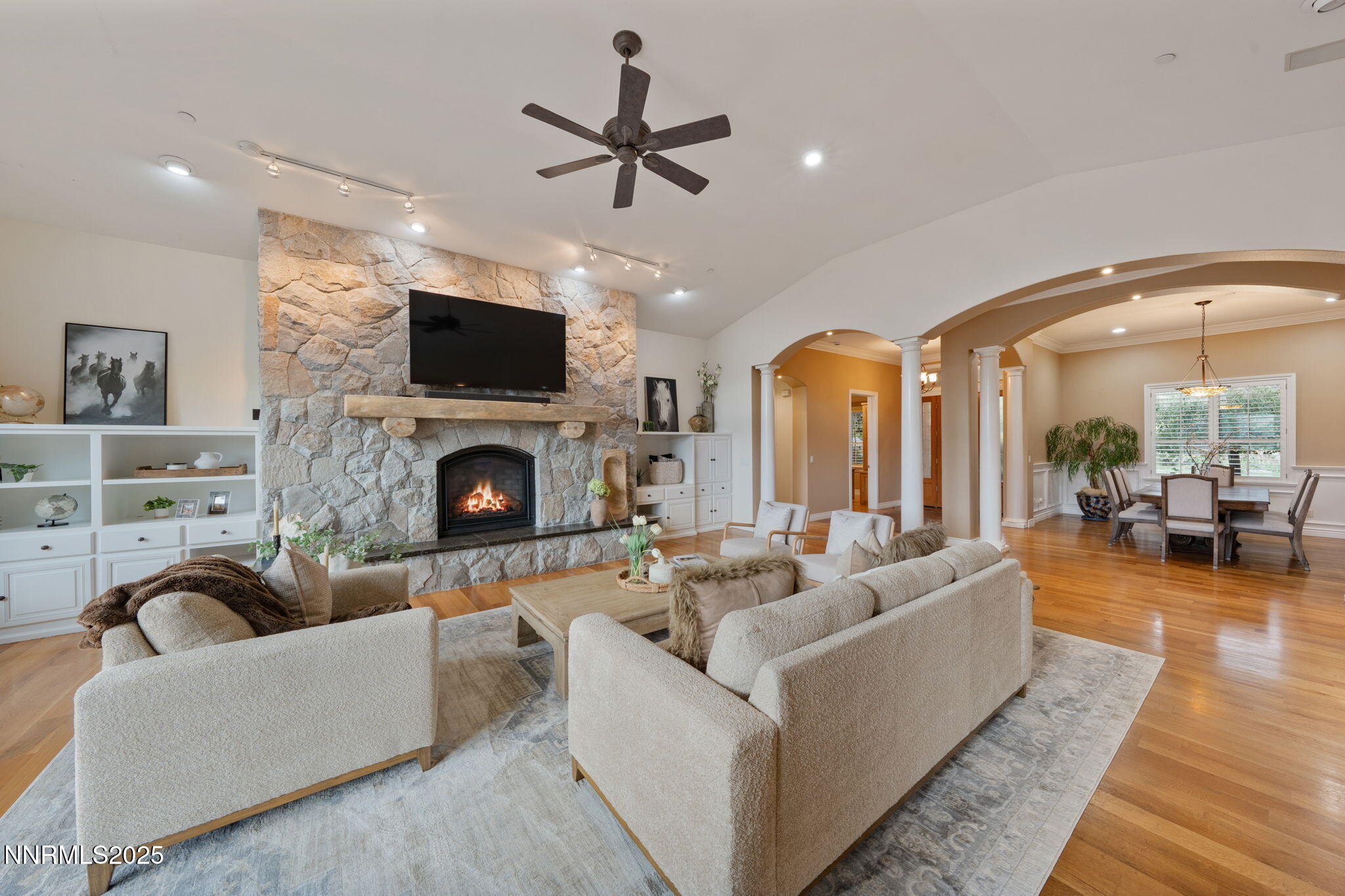 95 Ox-Yoke Lane Reno, NV 89521 - Photo 22 of 160 a living room with furniture a flat screen tv and a fireplace