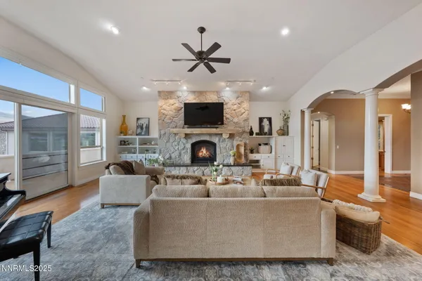 a view of a livingroom with furniture and a flat screen tv