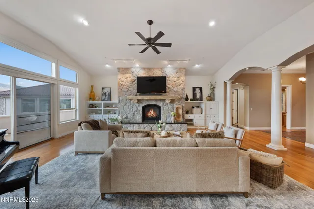 a view of a livingroom with furniture and a flat screen tv