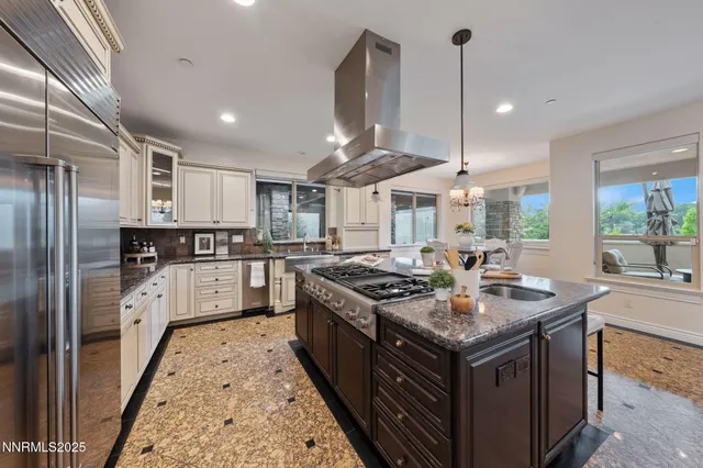 a spacious bedroom with a bed and a fireplace
