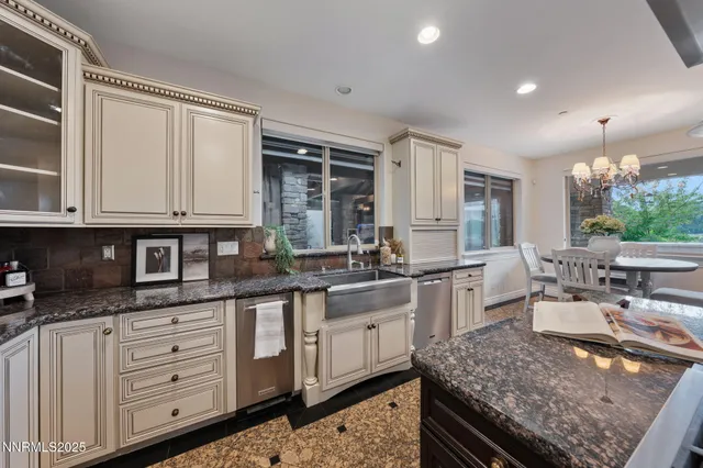 a bathroom with a granite countertop sink a mirror and shower