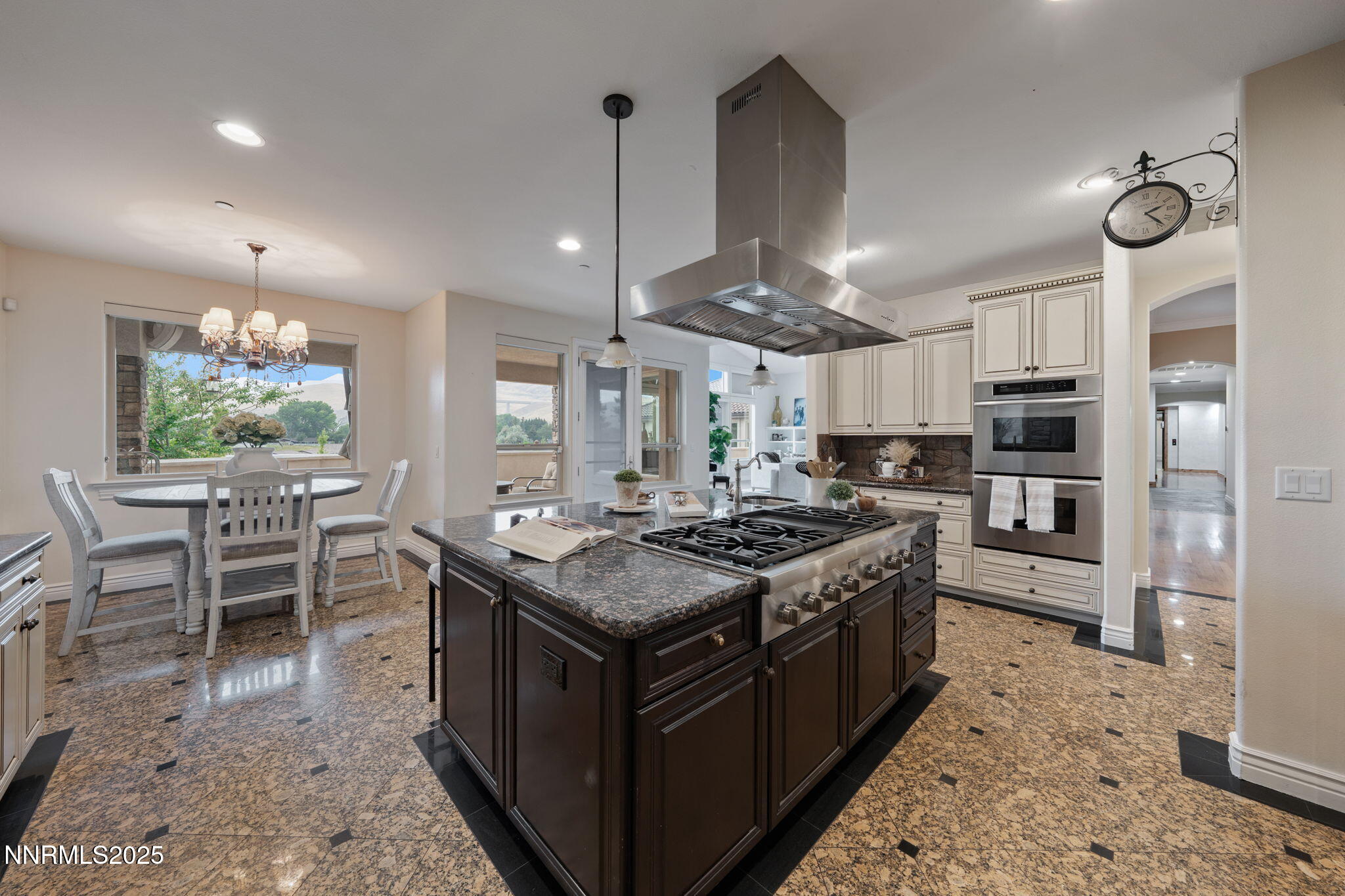 95 Ox-Yoke Lane Reno, NV 89521 - Photo 28 of 160 a kitchen with stainless steel appliances granite countertop a stove a sink a oven a dining table and chairs