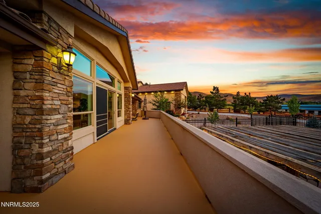 a view of a house with a yard and sitting area