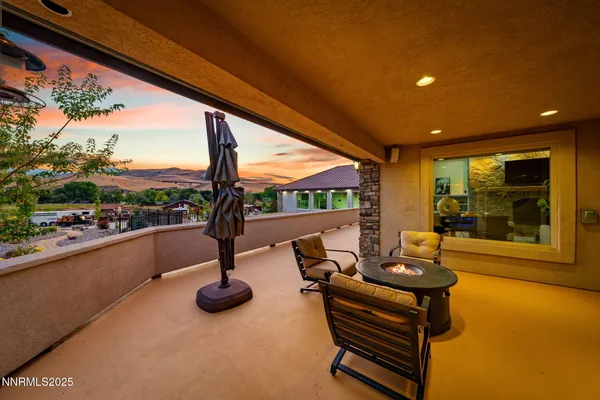 a view of swimming pool with outdoor seating