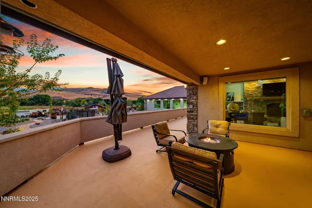 a view of swimming pool with outdoor seating