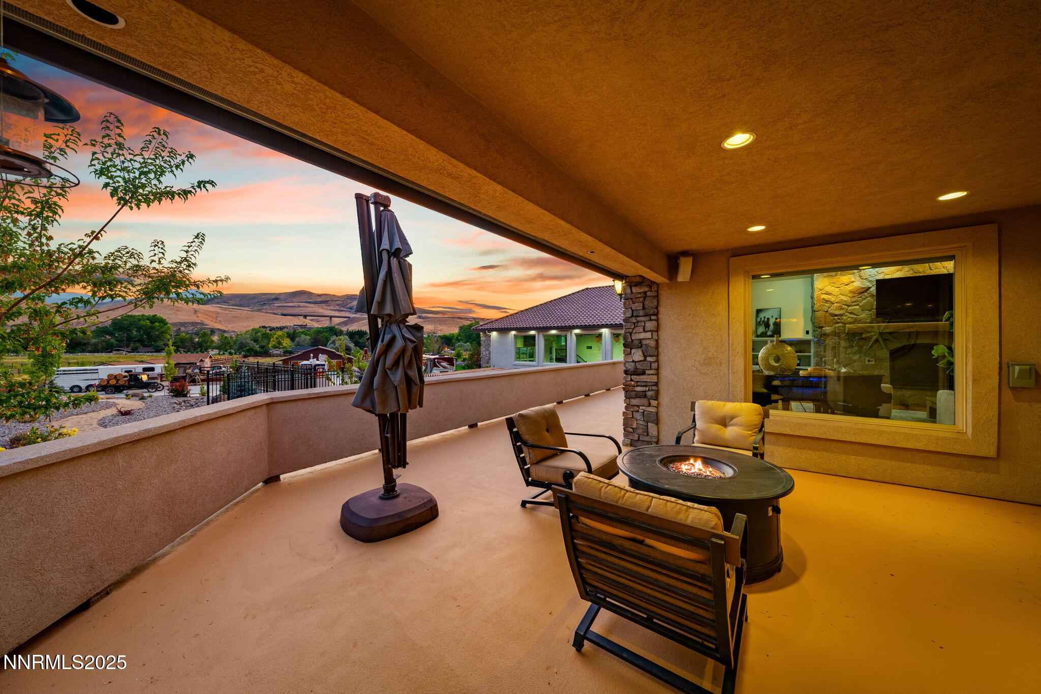 95 Ox-Yoke Lane Reno, NV 89521 - Photo 31 of 160 a living room with patio furniture and a floor to ceiling window