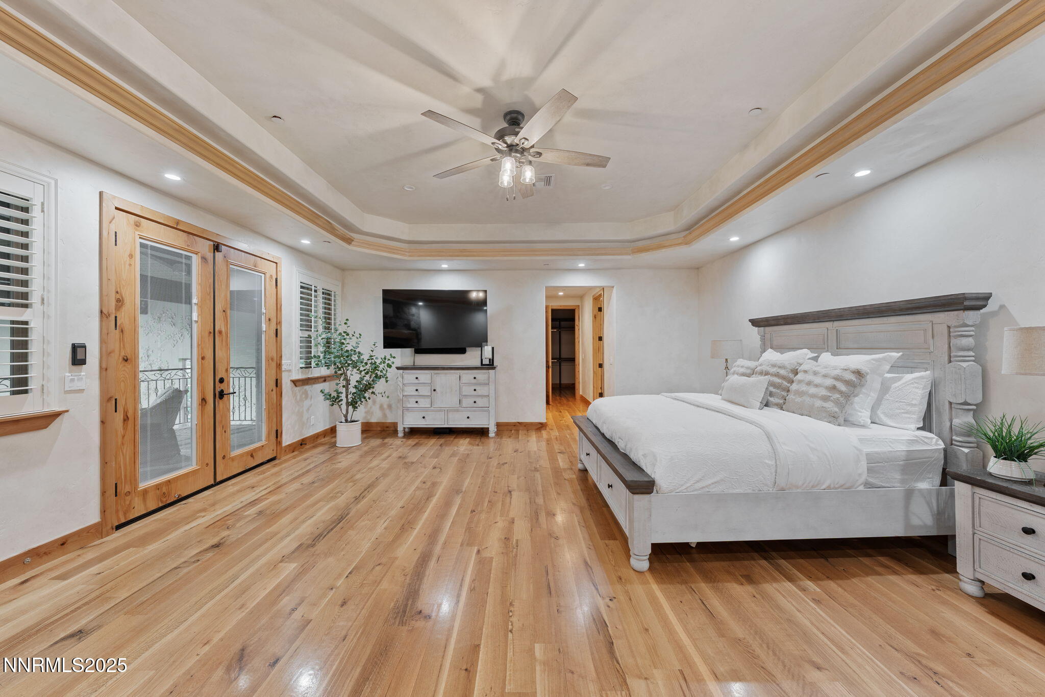 95 Ox-Yoke Lane Reno, NV 89521 - Photo 36 of 160 a spacious bedroom with a bed and a flat screen tv