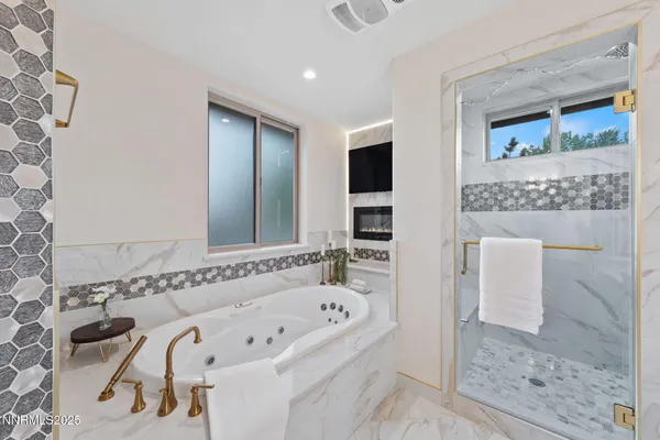 a kitchen with stainless steel appliances granite countertop a stove and a refrigerator