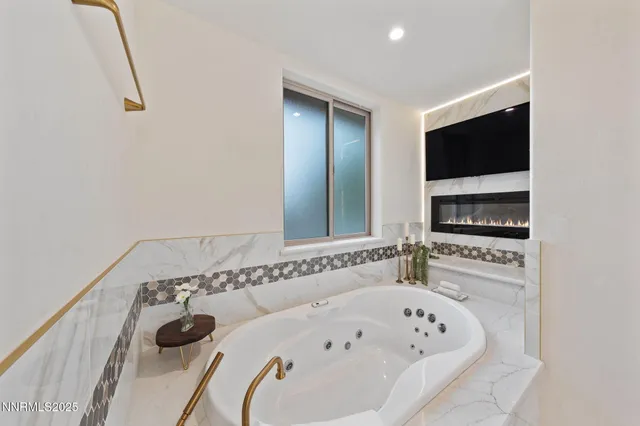 a kitchen with stainless steel appliances kitchen island granite countertop a sink and wooden cabinets