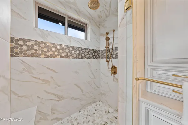 a living room with lots of furniture and a chandelier
