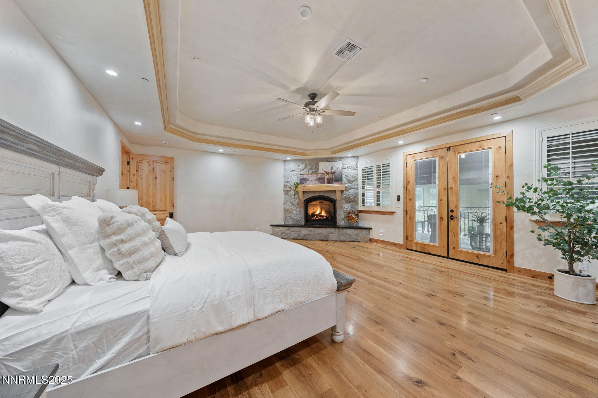 95 Ox-Yoke Lane Reno, NV 89521 - Photo 48 of 160 a spacious bedroom with a large bed a chandelier fan and windows