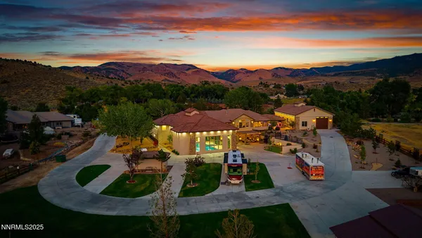 a living room with patio furniture and a floor to ceiling window