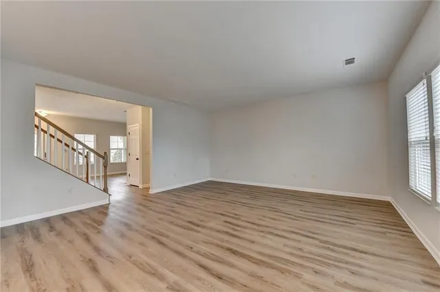 a view of an entryway with wooden floor and stairs
