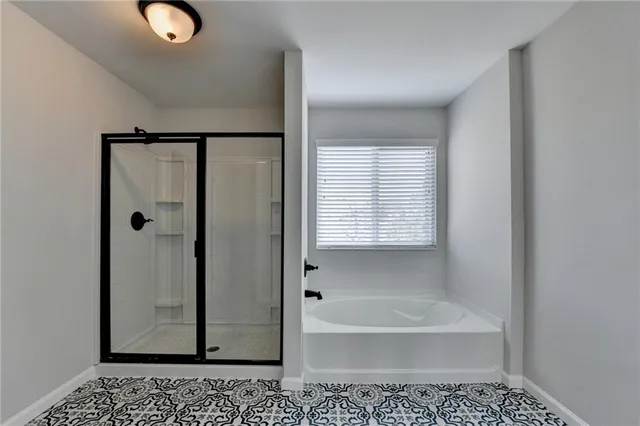 a balcony with wooden floor and fence