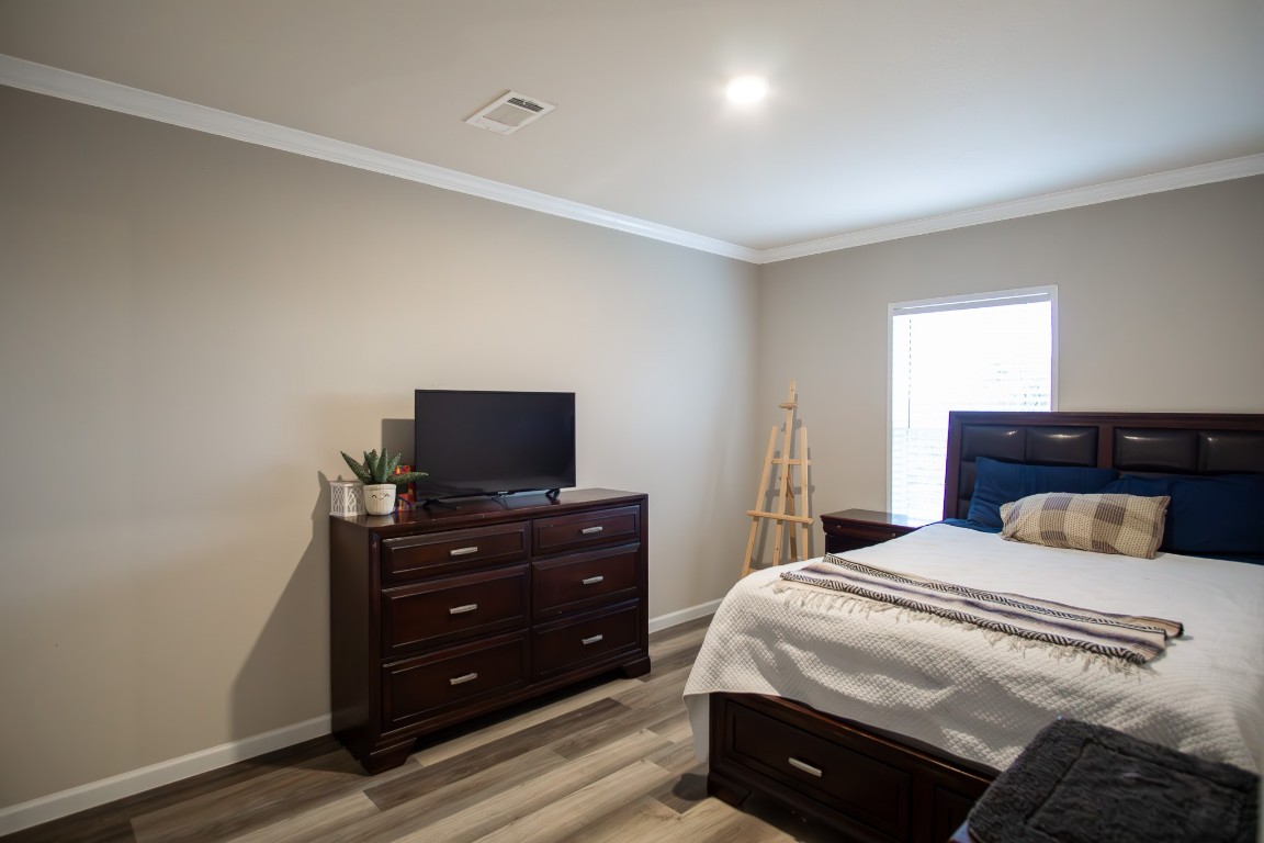3882 Dry Creek Road Lockhart, TX 78644 - Photo 13 of 18 a bedroom with a bed and a television